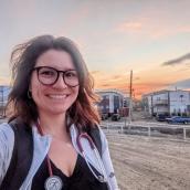 Photo of a person with sunset in background. 