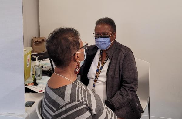 Registered Nurse, Martha Brown, administered the COVID-19 vaccine to Maxine Farmer during the Black Health and Wellness Clinic in Dartmouth on December 16. 