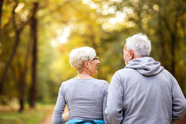 Older couple walking in the park
