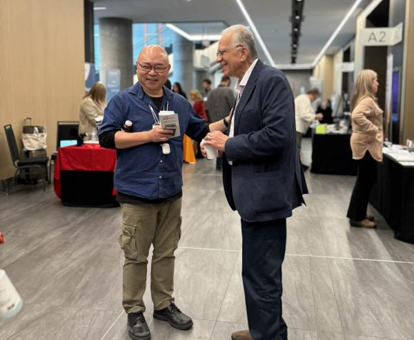 Attendees share a laugh during the vendor exhibition break; connection and collaboration at the heart of Care by Design.