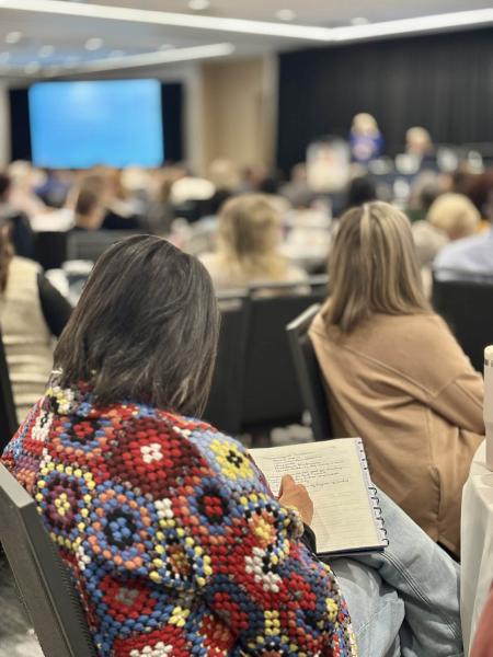An attendee takes notes during Delirium Recognition presented by Nurse Practitioner Dr. Kim Hill.