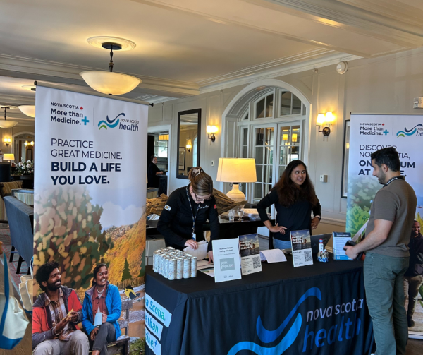 People gathering around booth