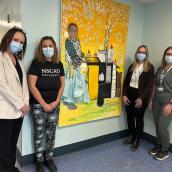 Terra Thibault, director, Cancer Care, Central and Western zones, Maria Valverde, artist, volunteer and patient; Marilyn Landry, manager, health services, systemic therapy; and Stephanie Whitman, clinical practice lead, chemotherapy unit