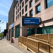 Image of the outside of a large Nova Scotia Health building that says "Citadel Health Home."