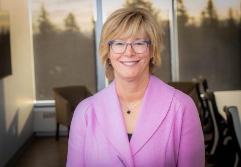 CEO of Nova Scotia Health, headshot of her smiling wearing a pink blazer.