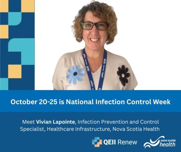 A woman with short, dark blonde hair wears glasses and a lanyard and a white shirt with flowers, smiling at the camera.