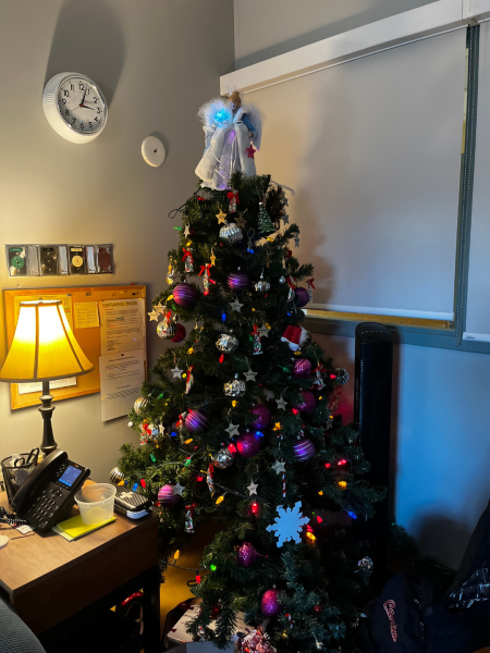 Nursing break room decorated with a tree for the holidays and an angel sits on top.