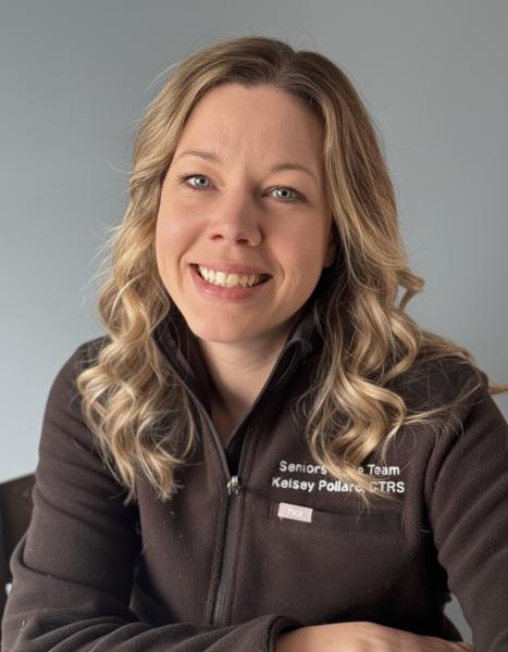 Picture of young woman in her 20s with long, wavy blond hair who is smiling.
