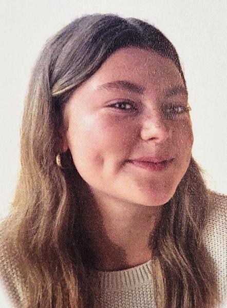 A head-and-shoulder image of a smiling woman.