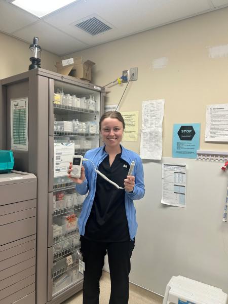 A registered nurse holds an ultrasound doppler
